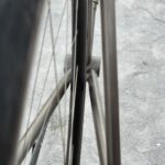 Inspecting wheels on bike